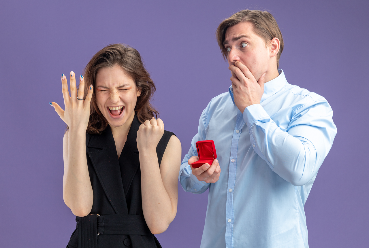 young-beautiful-couple-confused-shocked-man-with-red-